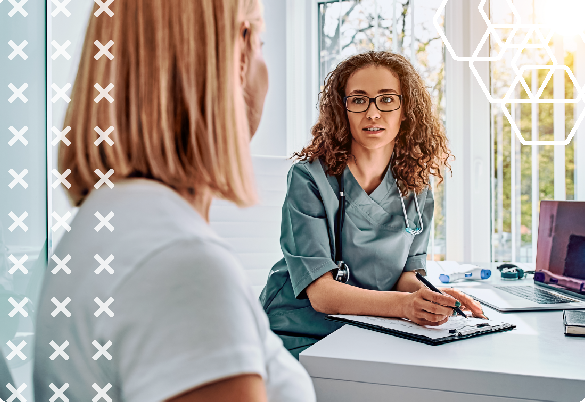 A medical specialist discusses treatment with a female patient