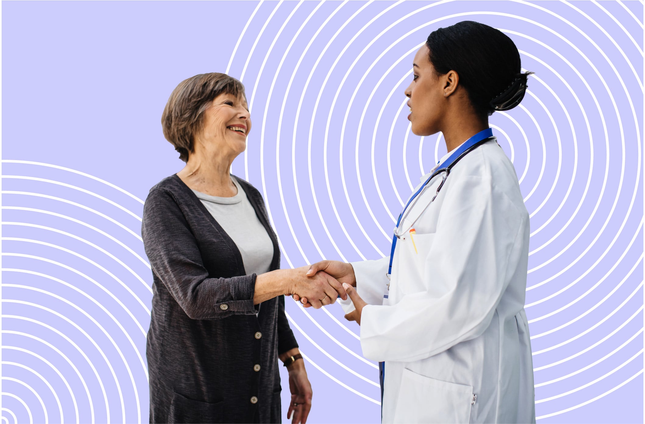 Female doctor with an older female patient she reached through medical practice marketing