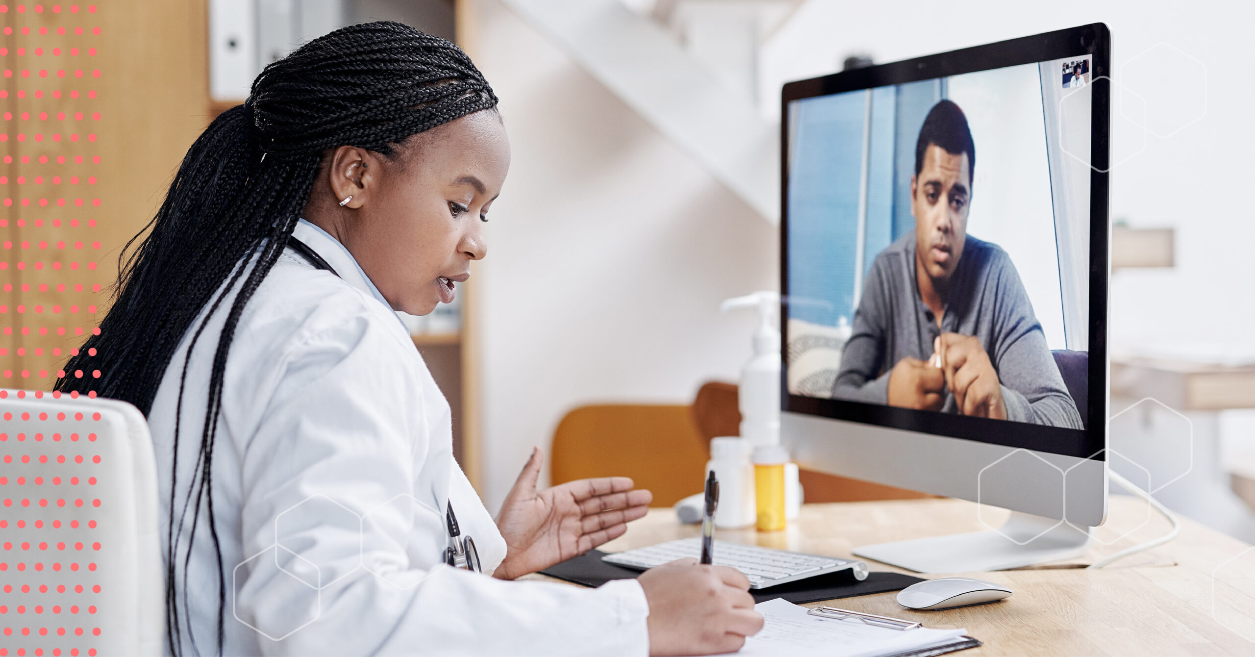 Doctor writing a prescription while on a virtual consultation with a patient.