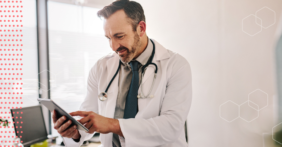 Doctor using mobile tablet in his office.
