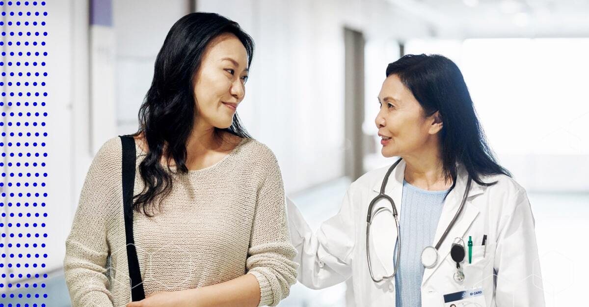 Doctor and patient smiling at each other.