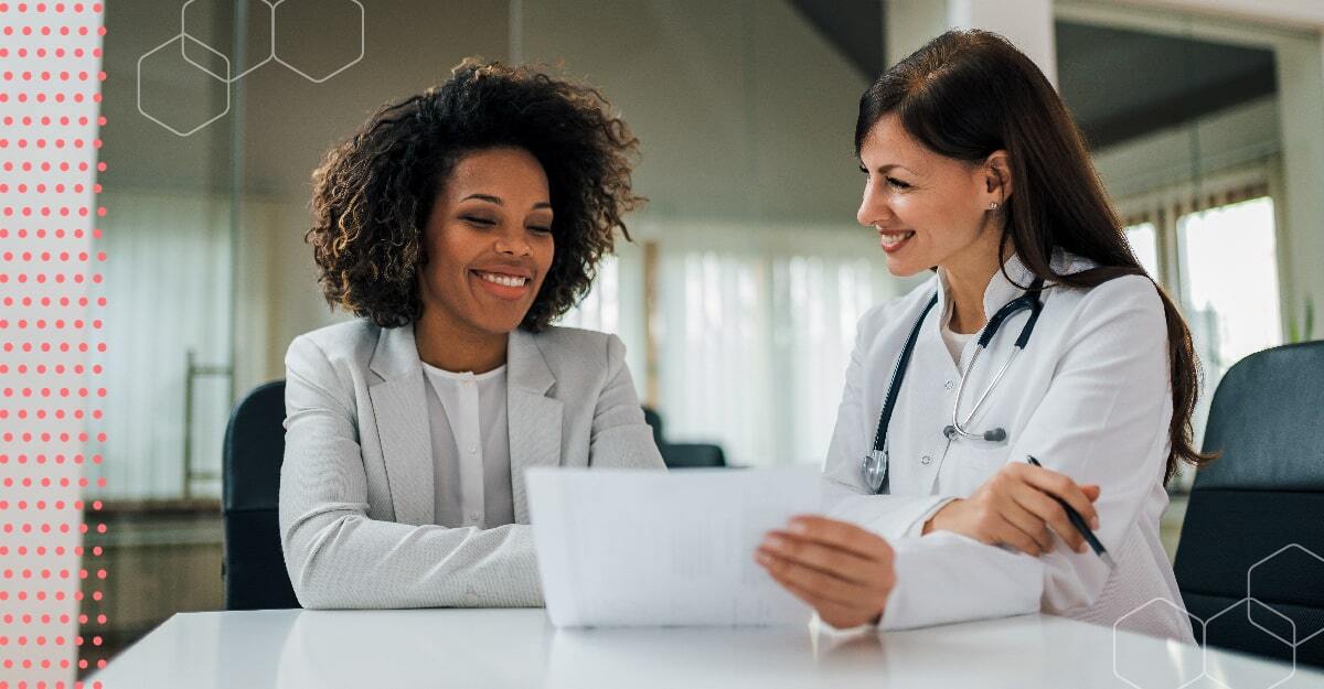 Business woman speaking to doctor.